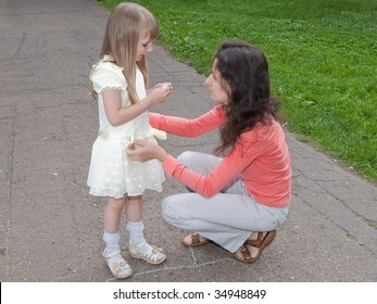 mother and daughter looking on each other outdoors - Shutterstock ID 34948849