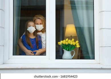 Mother and Daughter looking out for the quarantine to finish as soon as possible - Shutterstock ID 1681954423