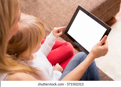 Mother and daughter looking at tablet 