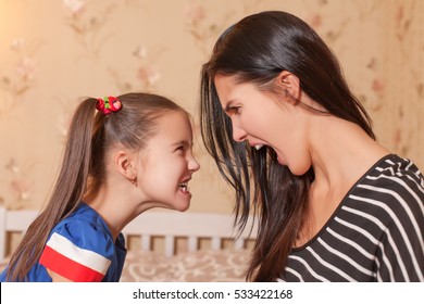 Mother and daughter make each other terrible faces