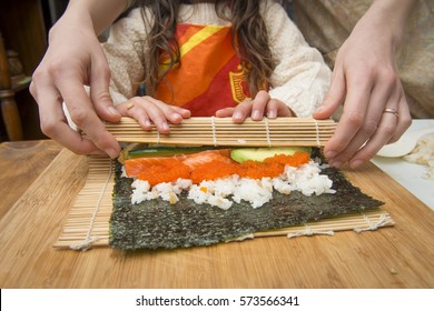 Mother And Daughter To Make Sushi Rolls