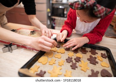 Mother And Daughter Making Cookies