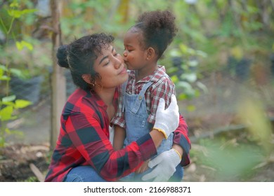 Mother And Daughter Making Outdoor Activities At Garden, Diverse Family And Best Friends Happy Motherhood Weekend Together With Kid, Mother's Day Concept