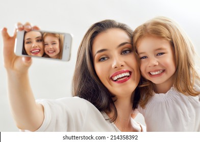 Mother And Daughter Making A Selfie