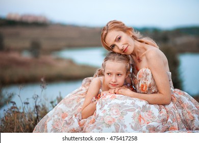 The Mother And Daughter In Matching Dresses.