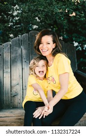 Mother And Daughter In Matching Outfits 