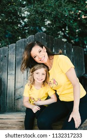 Mother And Daughter In Matching Outfits 