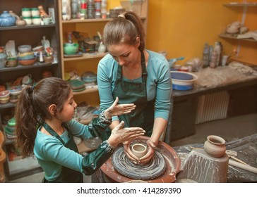 mother and daughter mold with clay, pottery children
 - Powered by Shutterstock