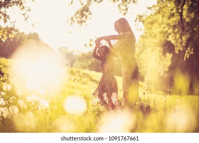 Mother and daughter at nature, spending time together. 
