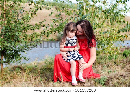 mother and daughter outdoors