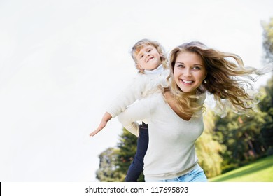 Mother and daughter in park - Powered by Shutterstock