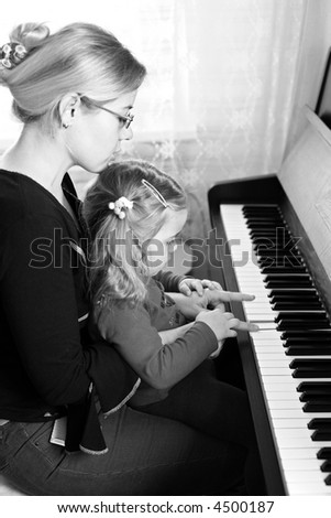 Similar – child girl playing checkers with her dad