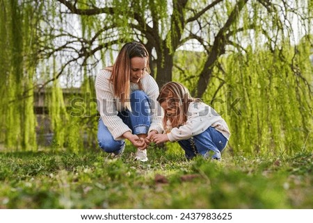 Similar – Image, Stock Photo Little girl and woman carrying basket with apples