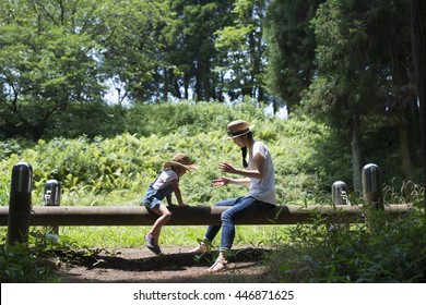 Mother and daughter playing in the park