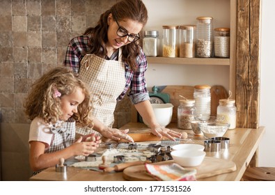 Mother and daughter playing and preparing dough in the kitchen.Family concept.
 - Shutterstock ID 1771531526