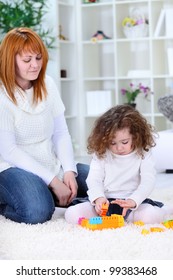 mother  and daughter playing with toys together - Shutterstock ID 99383468