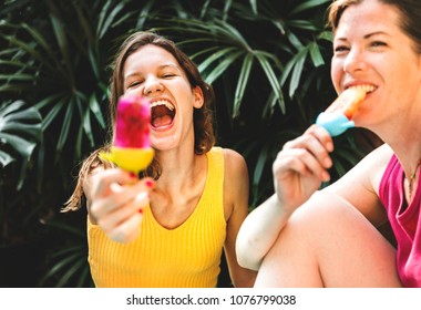 Mother and daughter with posicles - Powered by Shutterstock