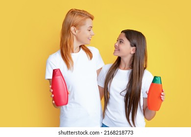 Mother And Daughter Presenting Bottle Cosmetic For Teen Girls, Shower Gel, Shampoo Or Conditioner For Long Hair. Body Cosmetics. Beauty Product For Whole Family.