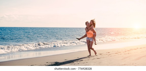 Mother And Daughter Running Next The Water On Tropical Beach - Mum Playing With Her Kid In Holiday Vacation - Family Lifestyle And Love Concept - Focus On Bodies