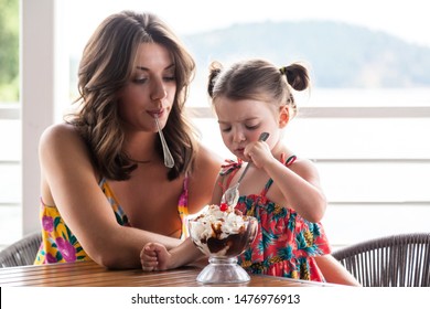 Mother And Daughter Sharing A Large Ice Cream Sundae In Coeur D' Alene Idaho