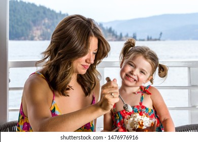 Mother And Daughter Sharing A Large Ice Cream Sundae In Coeur D' Alene Idaho