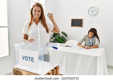 Mother And Daughter Smiling Confident Holding Vote Badge At Electoral College