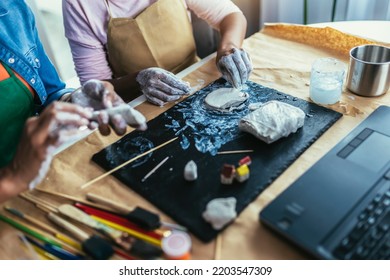 Mother And Daughter Spend Time Together And Sculpting From Clay At Home