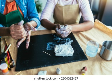 Mother And Daughter Spend Time Together And Sculpting From Clay At Home