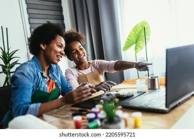 Mother And Daughter Spend Time Together And Sculpting From Clay At Home