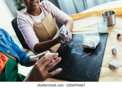 Mother And Daughter Spend Time Together And Sculpting From Clay At Home