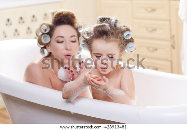 mother daughter bathing