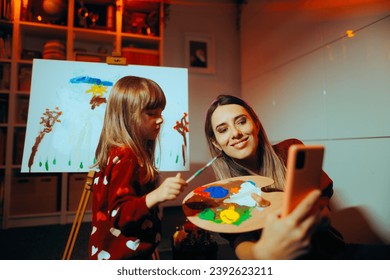 
Mother and Daughter Taking a Selfie While Painting Together. Happy family making memories bonding at home taking pictures 
 - Powered by Shutterstock