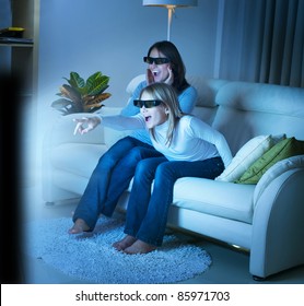 Mother with Daughter watching 3d film on TV - Powered by Shutterstock