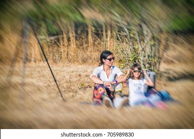 Mother And Daughter Watching Solar Eclipse.