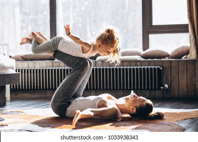 Mother And Daughter Yoga At Home