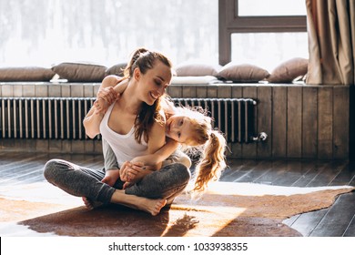 Mother And Daughter Yoga At Home