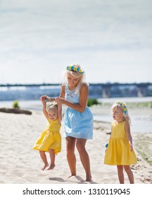 Mother and daughters on beautiful summer day. Summer vacation - Shutterstock ID 1310119045