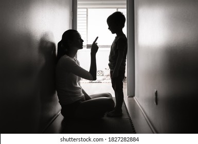 Mother disciplining her child that is missbehaving  - Shutterstock ID 1827282884
