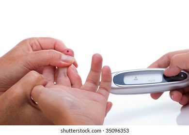 Mother Is Doing Glucose Level Finger Blood Test To Child