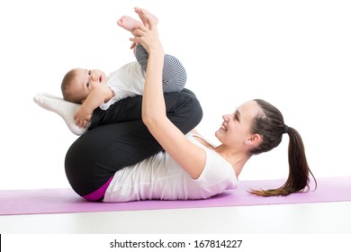 Mother doing yoga exercise with her baby
