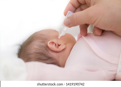 Mother Dribble Medication In Baby Ear. Ear Drops