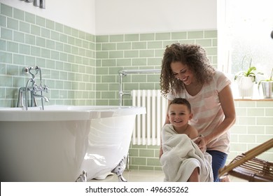 Mother Drying Son With Towel After Bath - Powered by Shutterstock