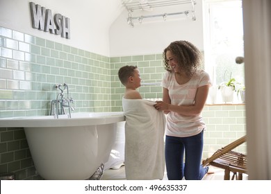Mother Drying Son With Towel After Bath
