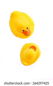 Mother Duck And Baby Duck Bath Toys On White Background; Overhead View