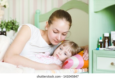 Mother Embraces The Sick Child