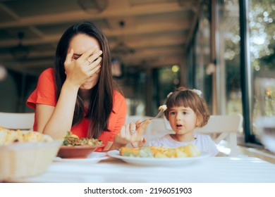 
Mother Exasperated By Picky Eating Daughter In A Restaurant. Disobedient Toddler Girl Being Fussy About Food
