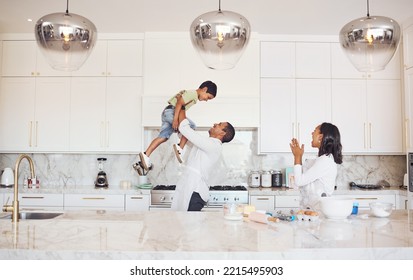 Mother, Father And Child Baking Or Cooking As A Happy Family In A House Kitchen With Mom And Dad Having Fun With Boy. Love, Learning And Parents Teaching Young Son Development Skills And To Bake Cake