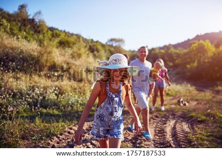 Similar – Image, Stock Photo little boy picks flowers in the garden