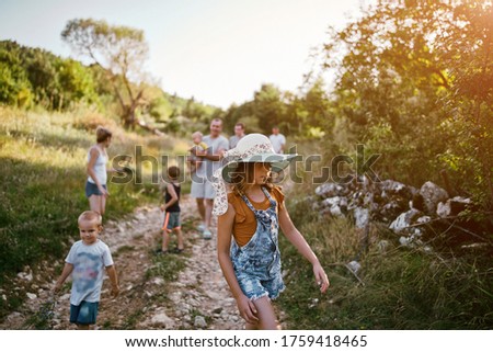 Similar – Image, Stock Photo little boy picks flowers in the garden