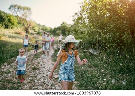 Similar – Image, Stock Photo little boy picks flowers in the garden